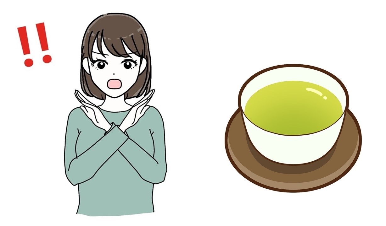 緑茶を飲むのを禁止する女性の画像