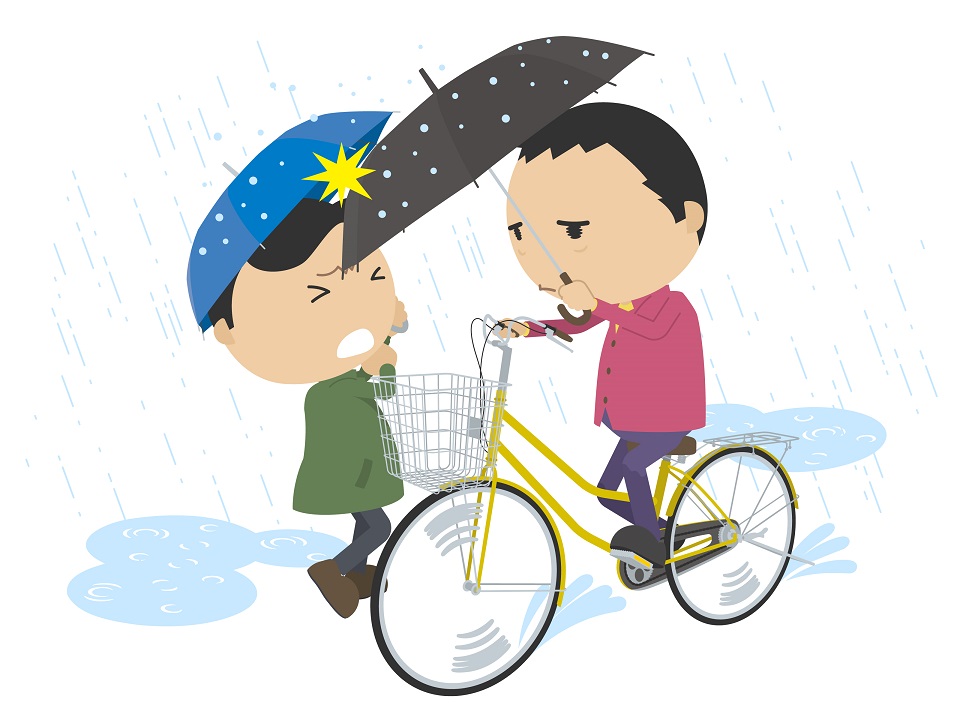 雨の中、自転車事故を起こしてしまった生徒の画像